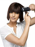 Утюжок для волос поможет справиться с непослушными кудрями. Источник http://salon-beauty.org.ua